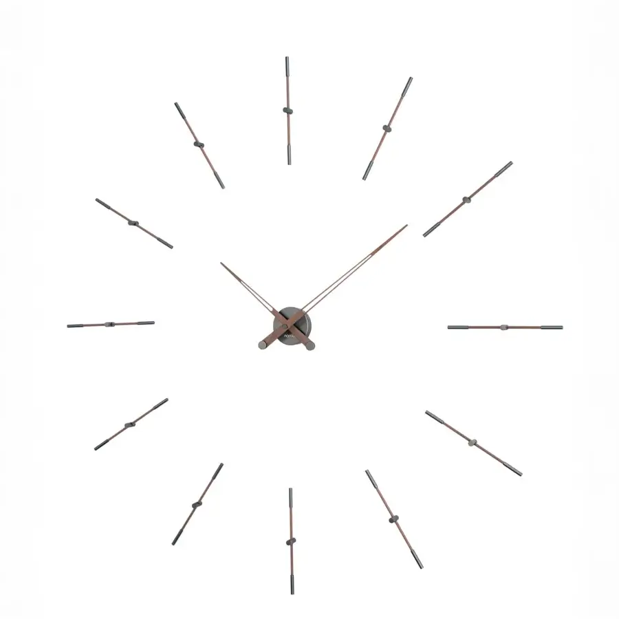 Distinguished Nomon Merlín wall clock crafted with dark metal and muted bronze time markers in balanced wood and metal