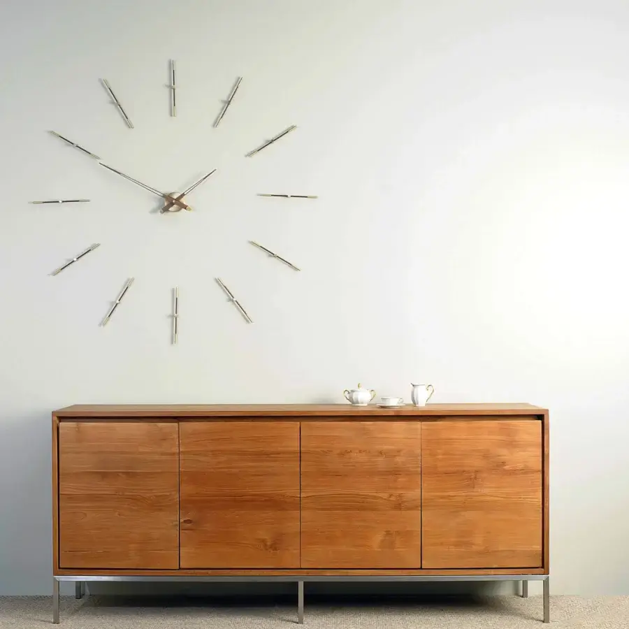 Distinguished Nomon Merlín wall clock crafted with wood and metal in chromatic gold and silver tones with a satin finish