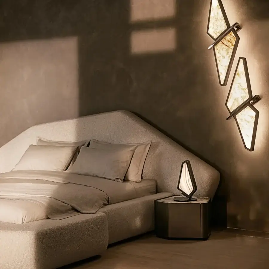 Distinguished Visionnaire Astralis table lamp with irregular polygonal metal form and brushed linear satin finish illuminating warm tones