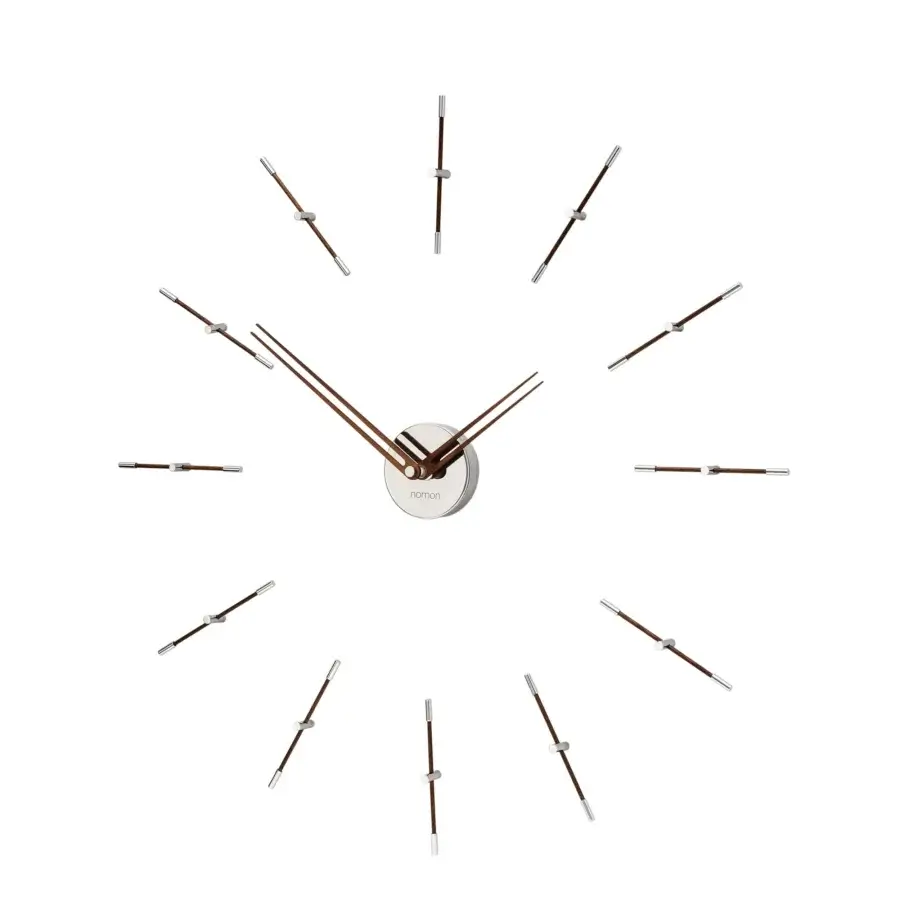 Elegant Nomon Mini Merlín wall clock with twelve slender metallic time signals and brushed silver finish