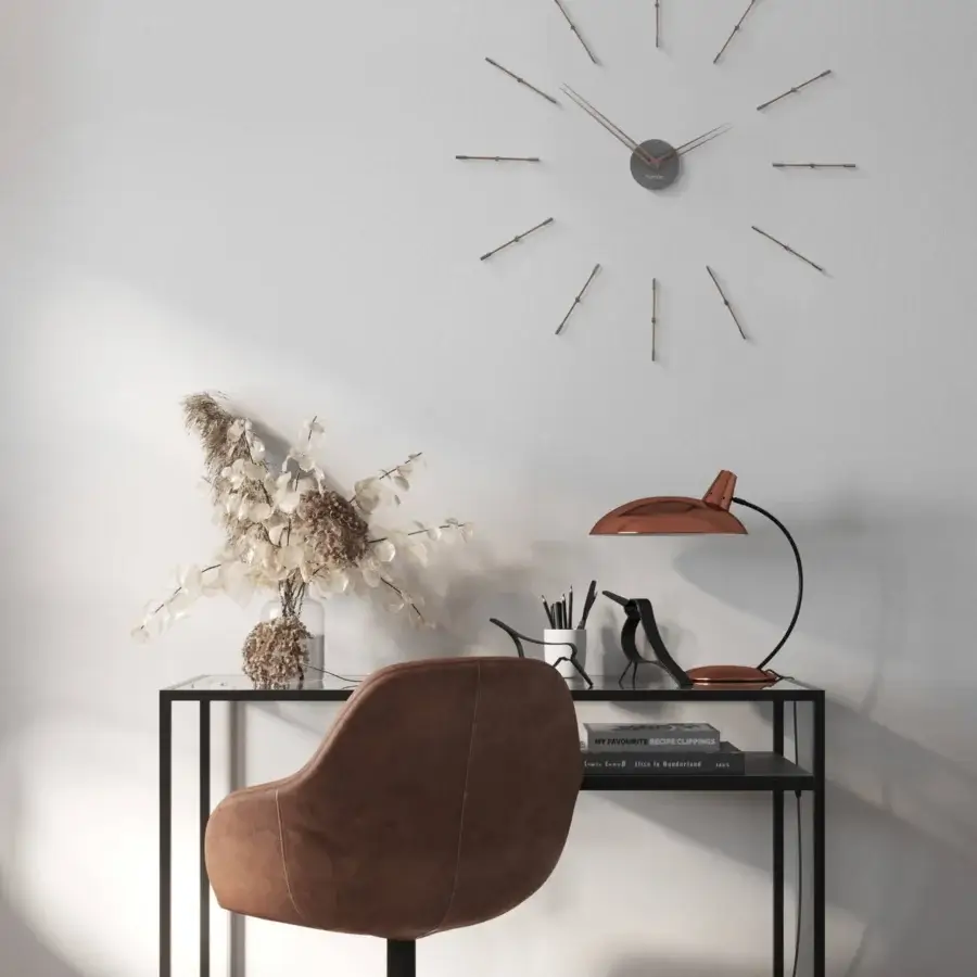 Elegant Nomon Mini Merlín wall clock with slender time signals in wood and metal boasting a matte finish