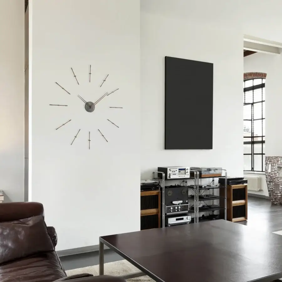 Superior Nomon Mini Merlín wall clock crafted with wood and metal in a sophisticated metallic gray finish