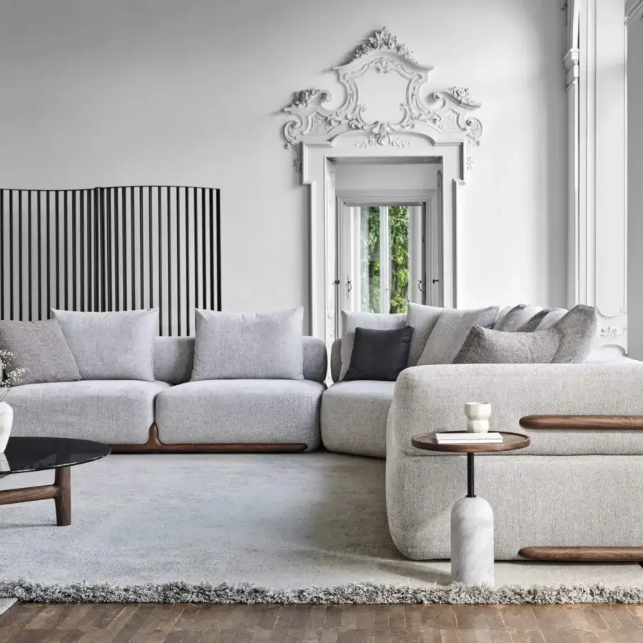 Superior Porada Klem sectional built with canaletto walnut and upholstered in light gray textured fabric