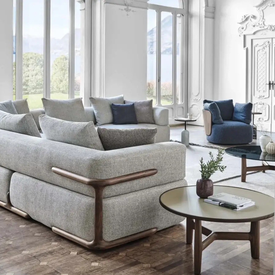Lavish Porada Klem sectional built with canaletto walnut and light gray woven fabric upholstery accented with darker gray-blue cushions