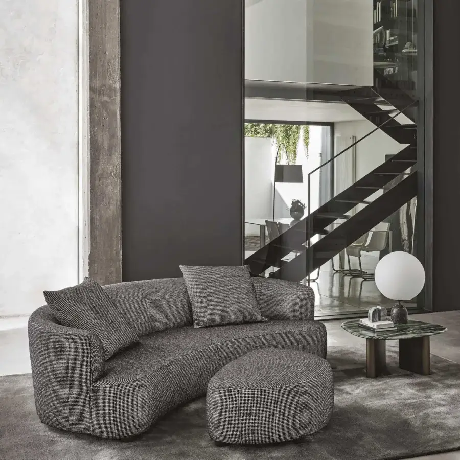 Superior Porada Yves sofa upholstered in textured muted gray fabric with solid Canaletta walnut feet