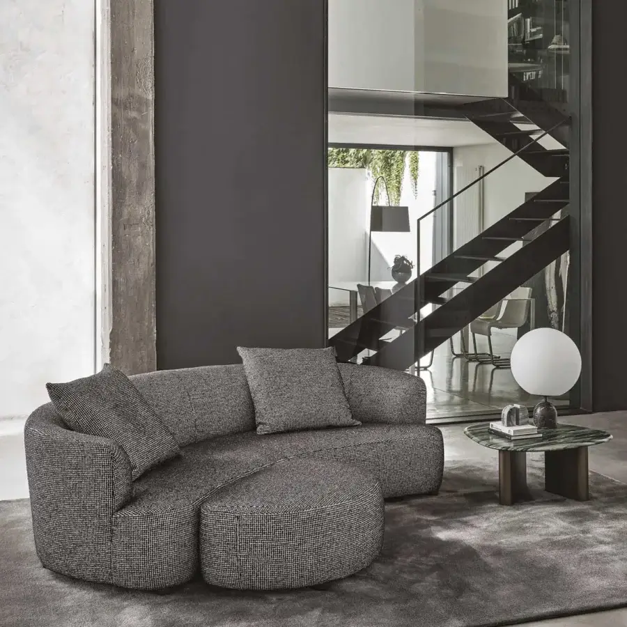 Distinctive Porada Yves sofa upholstered in textured muted gray fabric with solid Canaletta walnut feet