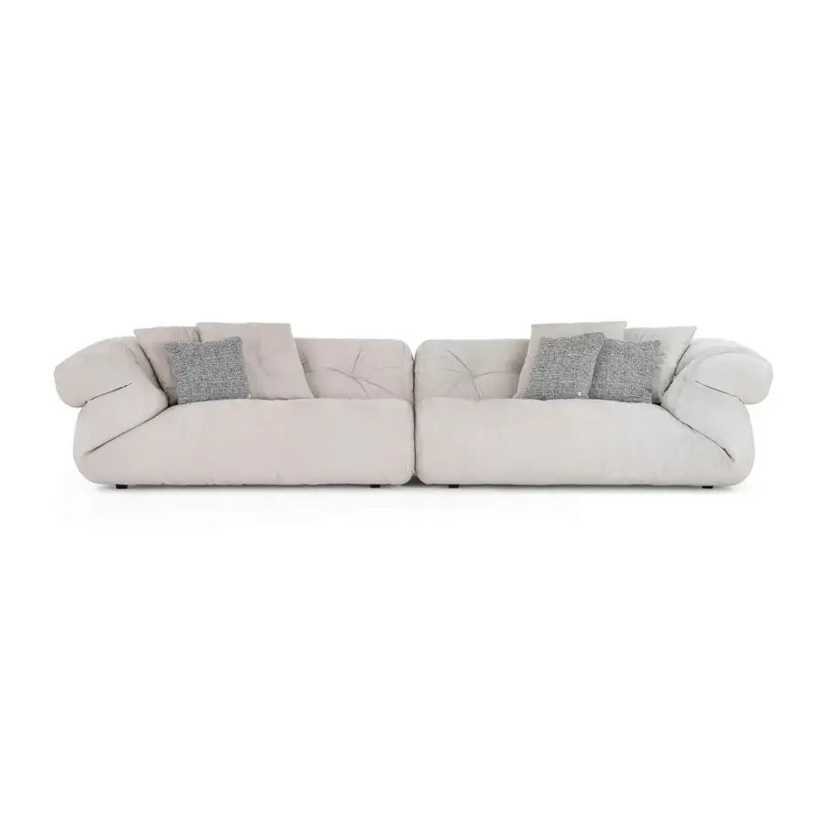 Sumptuous Visionnaire Walker sofa upholstered in light beige textured fabric with quilted armrests and gray cushions