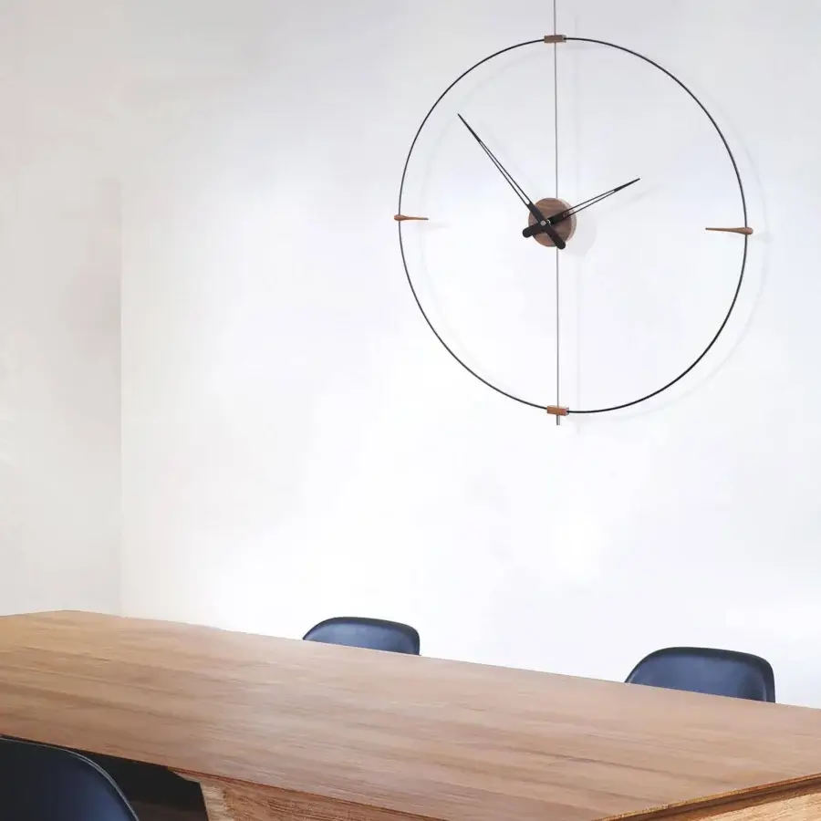 Exceptional Nomon Mini Bilbao wall clock with a dark metal ring and light-toned wooden blocks crafted with a matte finish