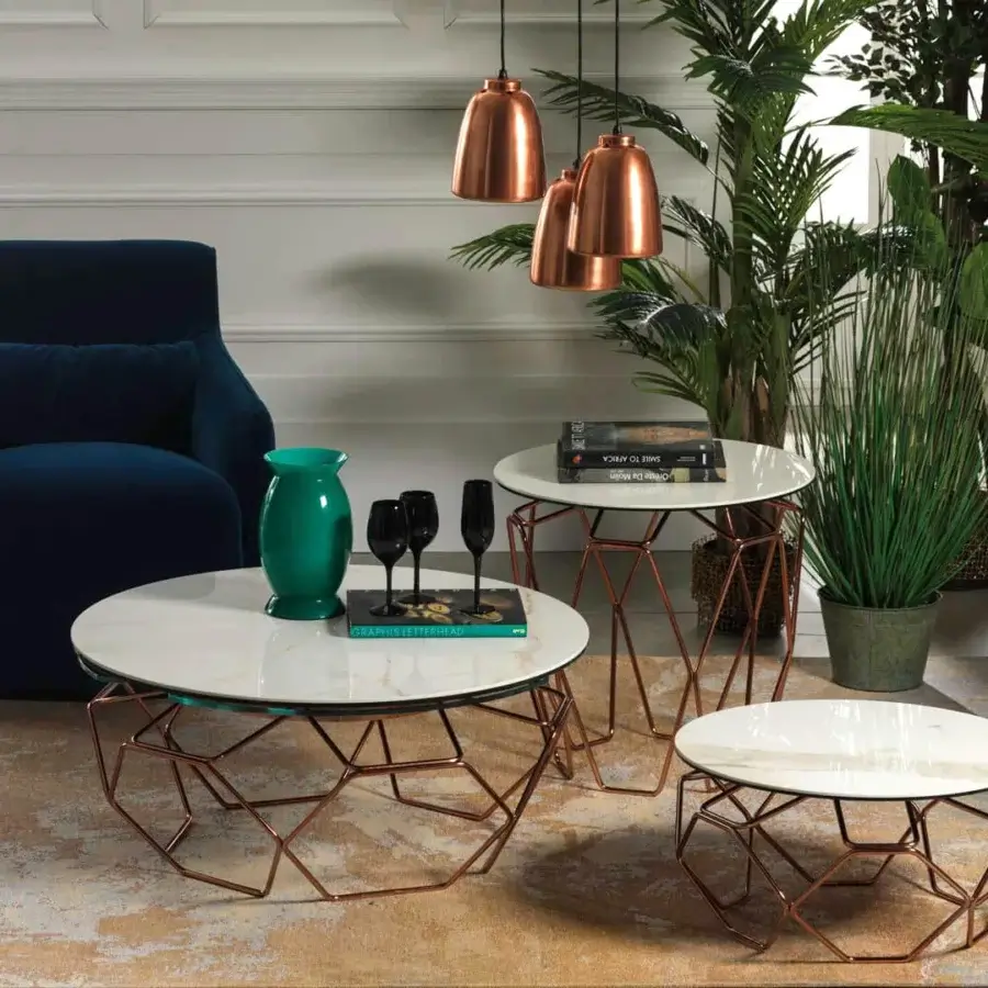 Elegant Naos Hive coffee table with rotating ceramic and glass tops supported by copper-toned galvanized steel base crafted in Italy