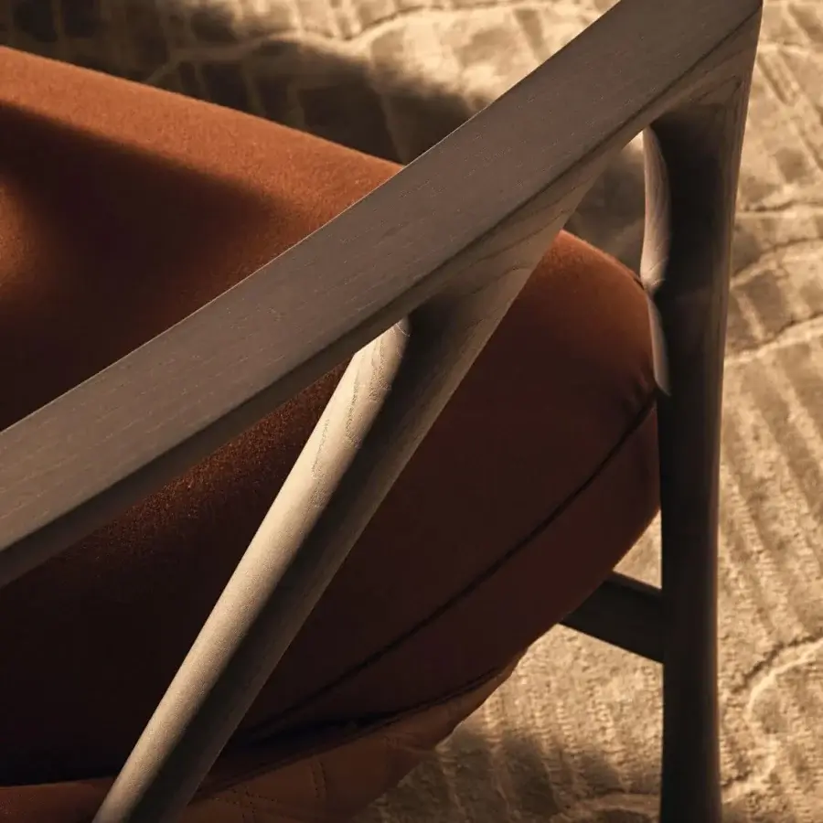 Distinguished Visionnaire Alya lounge chair with sculpted solid ash wood, reddish-brown leather and satin finish