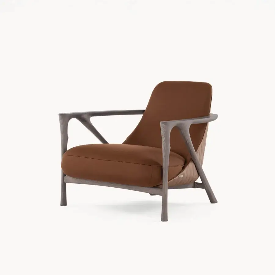 Distinguished Visionnaire Alya lounge chair with sculpted solid ash wood and warm brown leather upholstery featuring diamond quilting