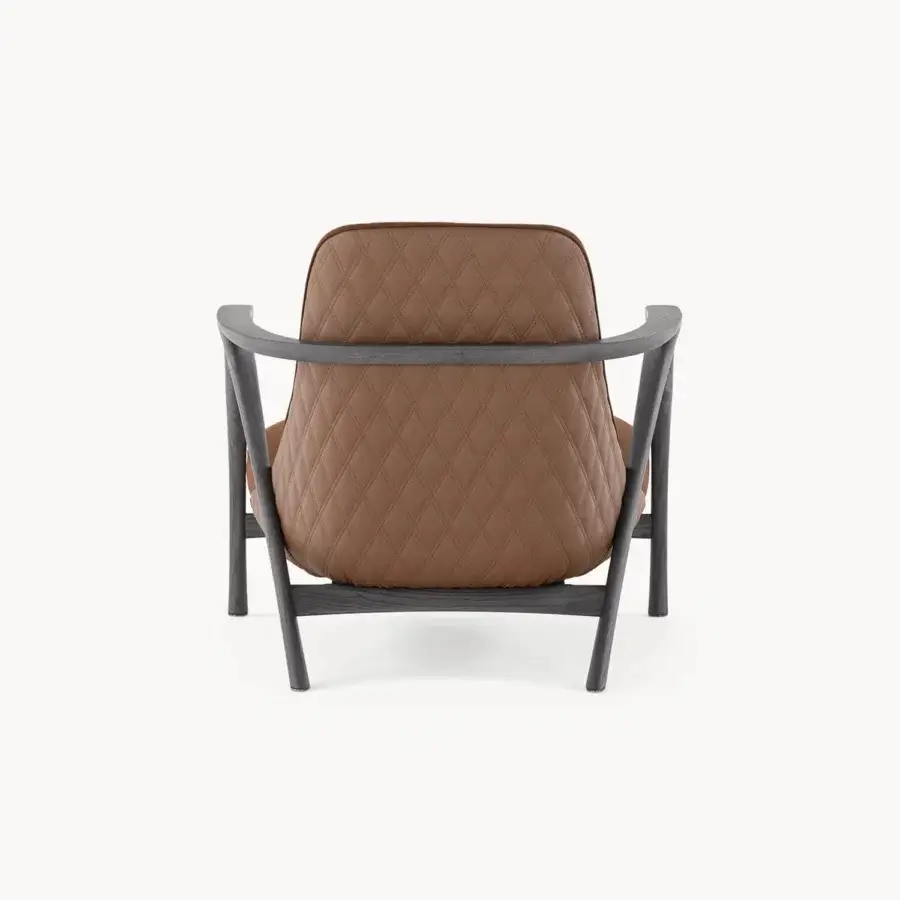 Lavish Visionnaire Alya lounge chair with sculpted solid ash wood, warm brown textile upholstery and diamond-quilted backrest finish