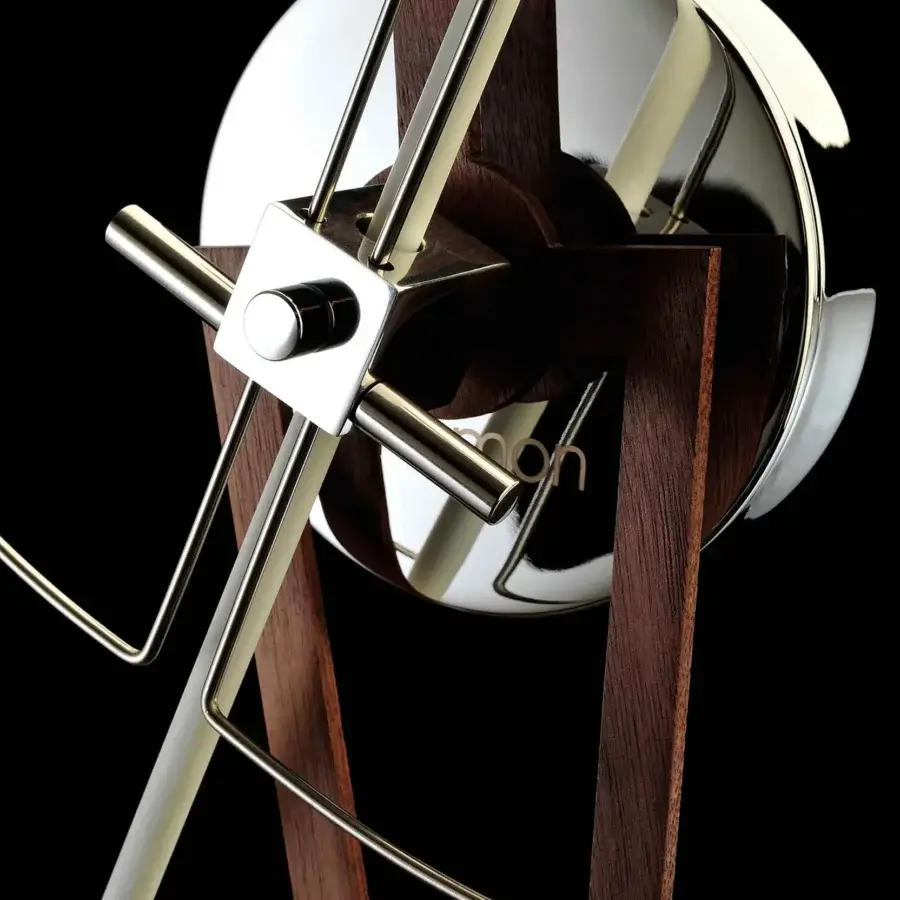 Elegant Nomon Cris wall clock built in dark brown satin wood with polished silver-toned metal and a fiberglass minute hand