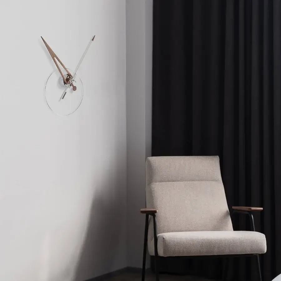 Exceptional Nomon Cris wall clock with a fiberglass minute hand and transparent face revealing intricate internal mechanism in silver tones