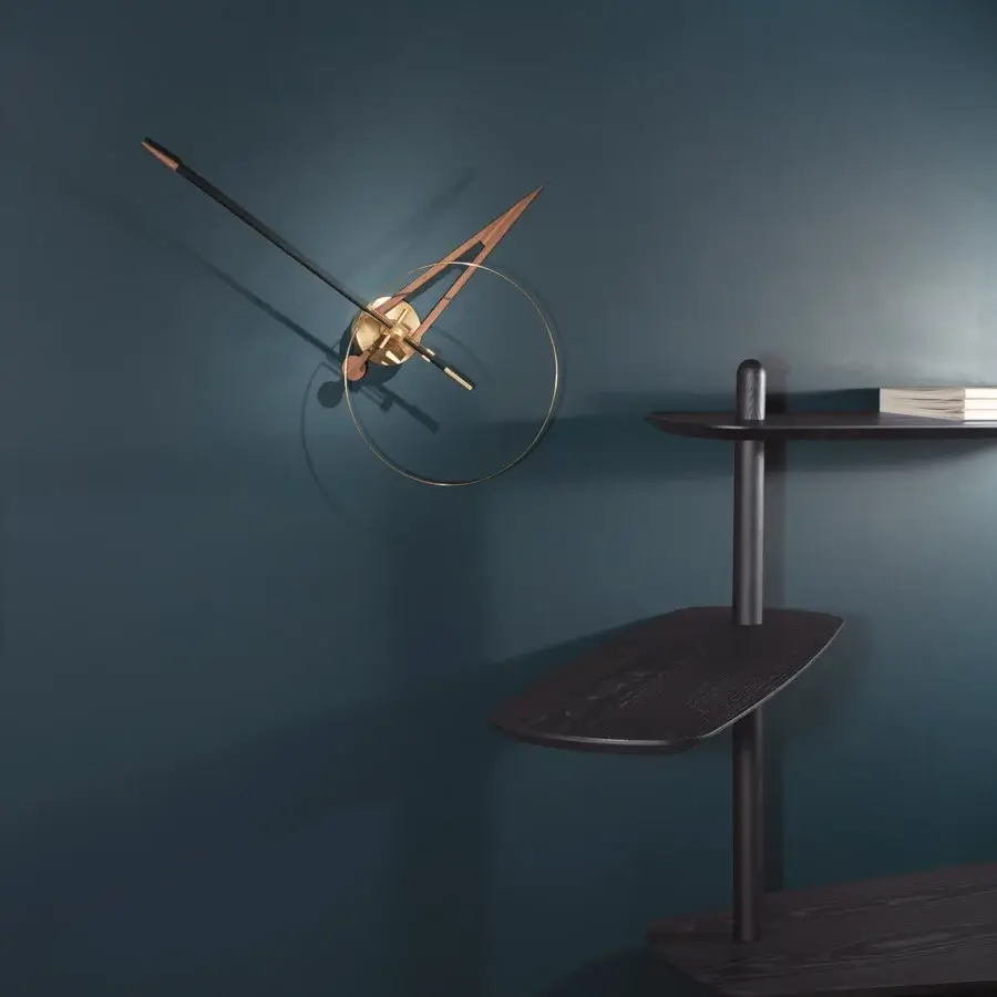 Distinguished Nomon Cris wall clock crafted in bronze tone fiberglass with a sleek metallic ring and satin finish