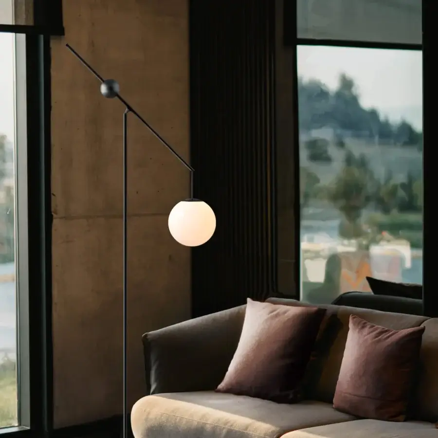 Distinguished Luceplan Malamata floor lamp crafted in matte dark gray metal with a frosted white blown-glass diffuser for balanced illumination