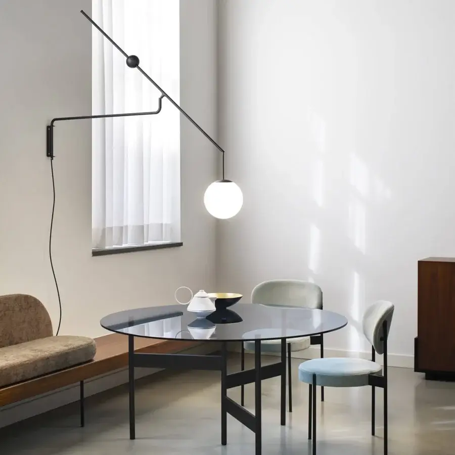 Elegant Luceplan Malamata wall lamp in matte black metal with a blown-glass diffuser and asymmetrical form