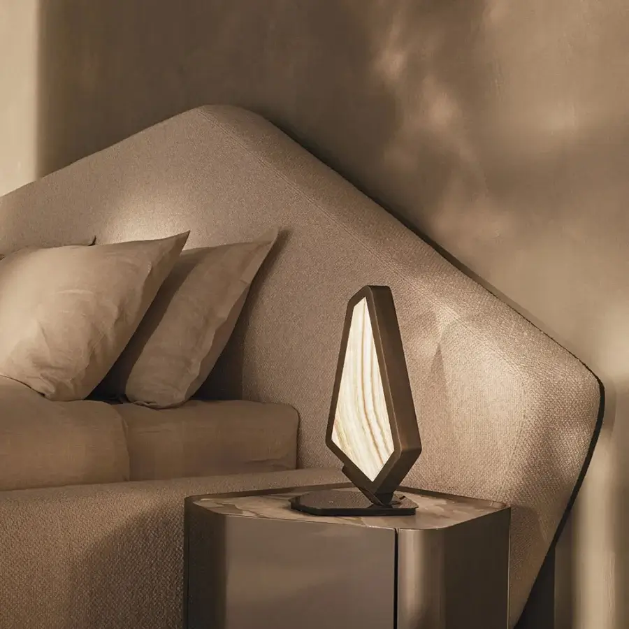 Exceptional Visionnaire Neolito bed with a curved headboard upholstered in neutral beige designer fabric with a matte finish