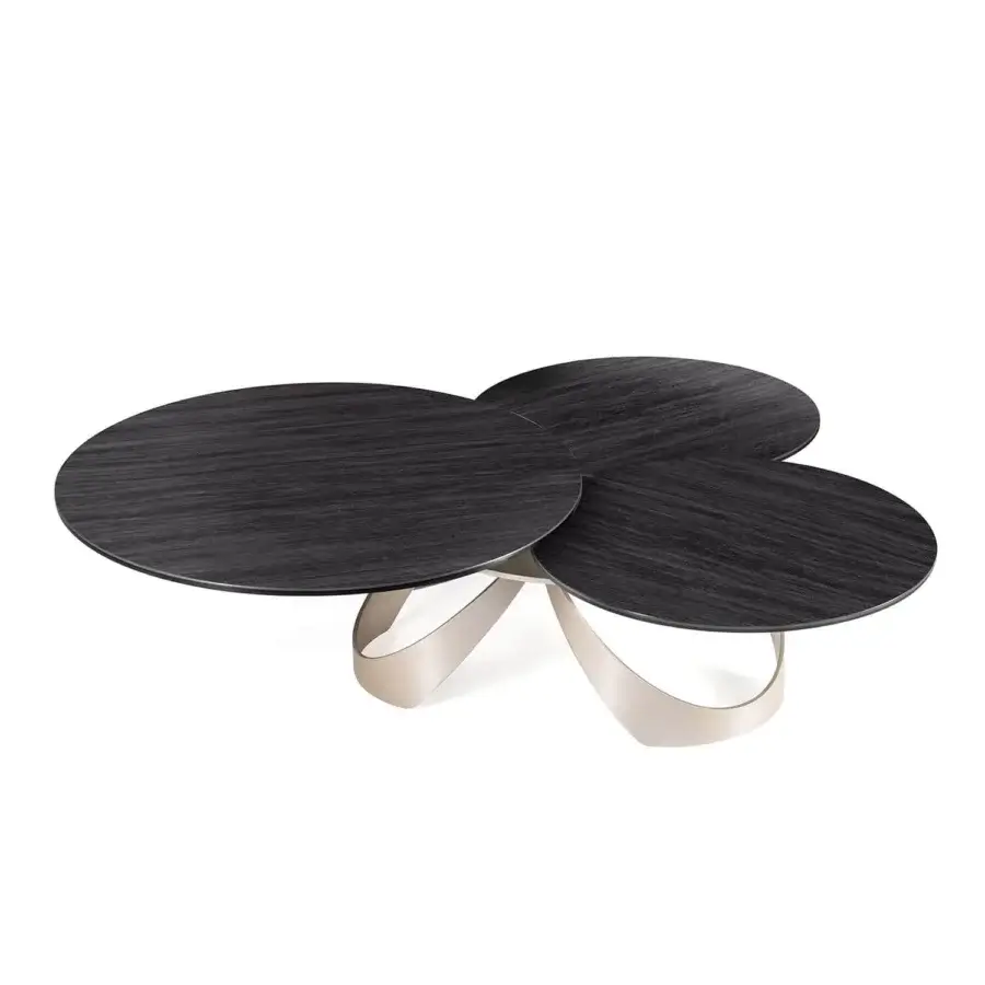 Innovative Naos Avior coffee table with expanding ceramic tops and a satin painted steel base exhibiting dark wood-grain finish