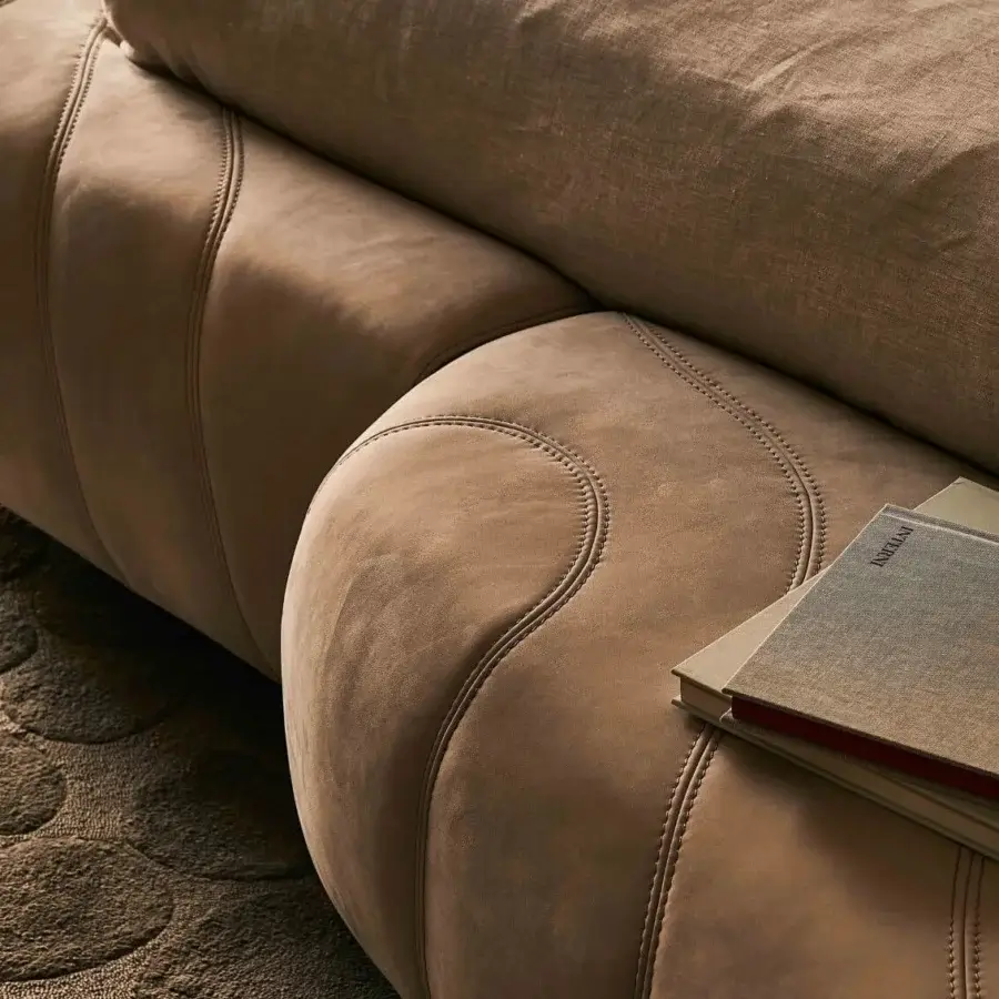 Distinguished Visionnaire Neolito Bold bed upholstered in warm brown leather with decorative quilting and continuous acrylic padding