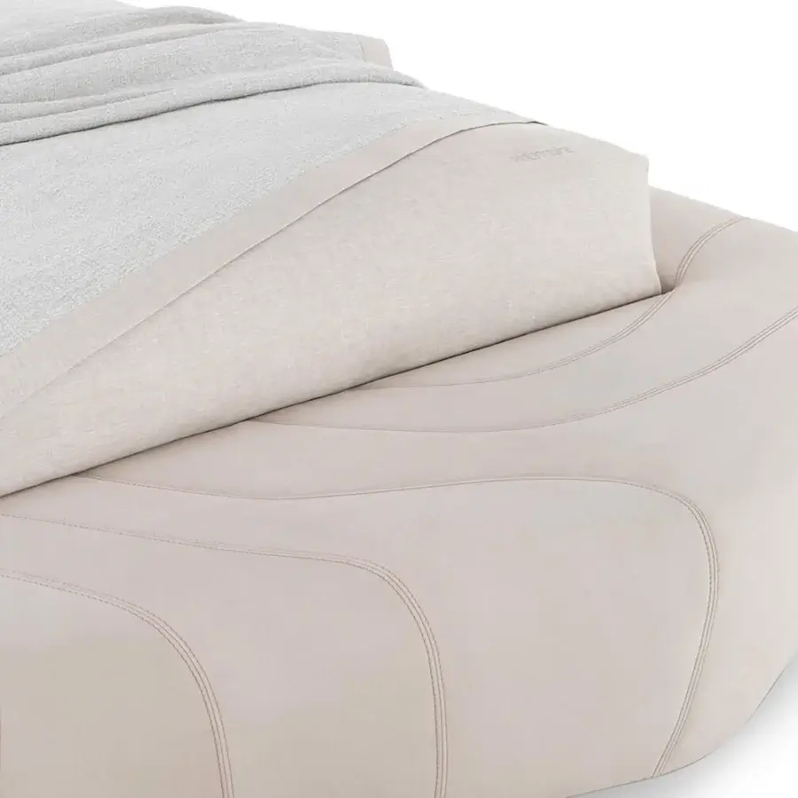 Luxury Visionnaire Neolito Bold bed upholstered in pale beige leather with smooth matte finish and decorative quilting