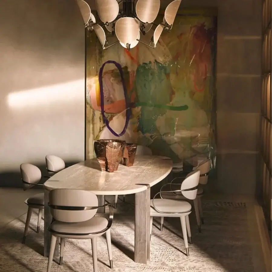 Exceptional Visionnaire Mystic table with stone surface displaying beige, cream, and gray veining plus hand-textured cast aluminum legs and matte finish