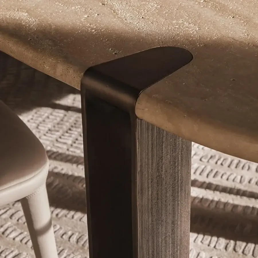 Superior Visionnaire Mystic table with warm beige tabletop and hand-textured cast aluminum legs in polished finish