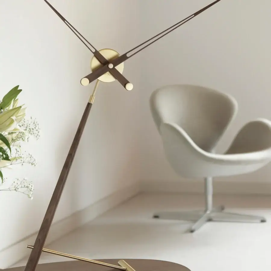 Exceptional Nomon Puntero table clock crafted in contrasting medium-dark wood with polished gold-tone metal for a minimalist aesthetic