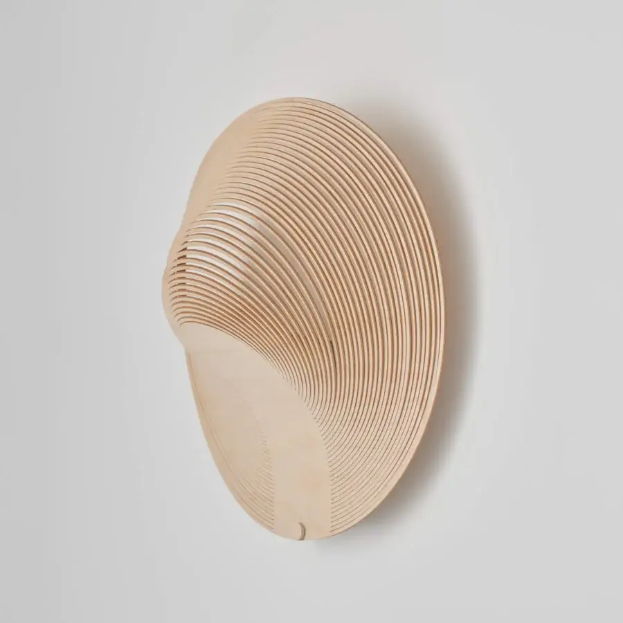 Distinctive Luceplan Illan wall lamp crafted in layered wood with a satin finish and warm upward illumination