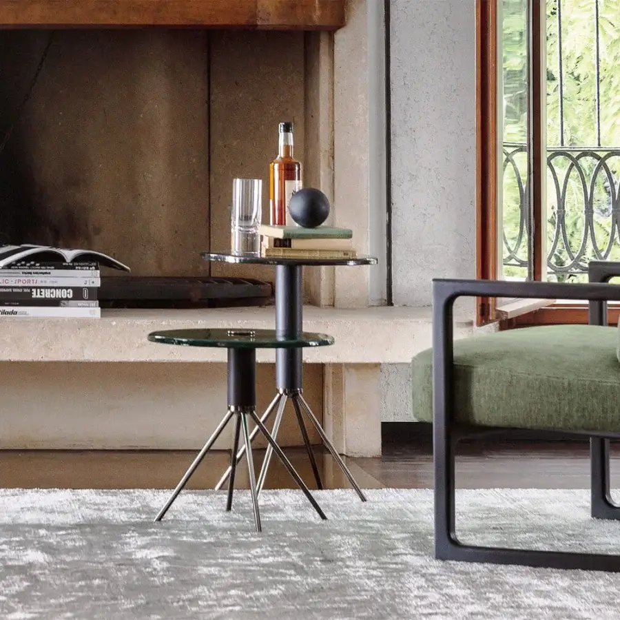Elegant Porada Jelly coffee side table with clear cast glass top and dark matte black chromed metal base crafted in canaletto walnut