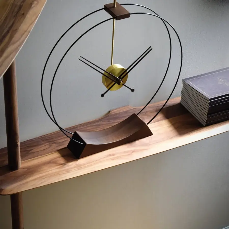 Distinguished Nomon Aire table clock crafted in walnut wood with brass details and satin finish