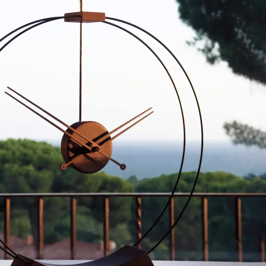 Exceptional Nomon Aire table clock crafted in walnut wood with matte brass accents and a dark metal framework