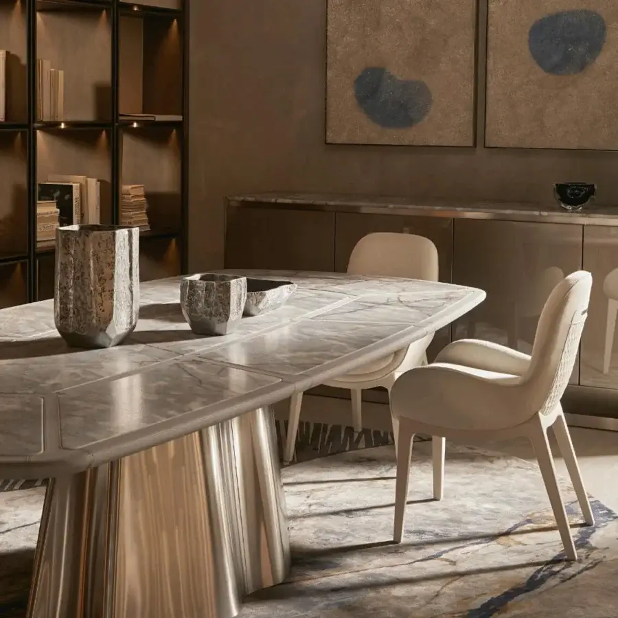 Distinguished Visionnaire Vortex table with a light marble top and satin-finished steel base crafted in a wave-like form