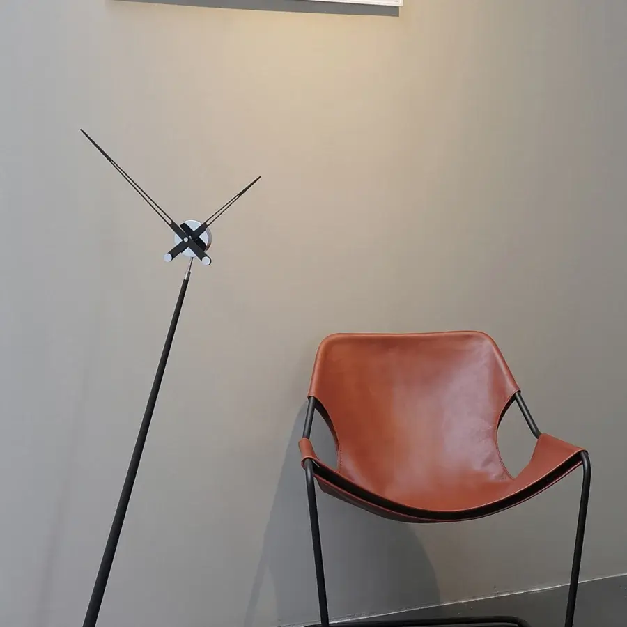 Exceptional Nomon Pisa Floor Clock with a dynamic silhouette and stark black solid wood finish