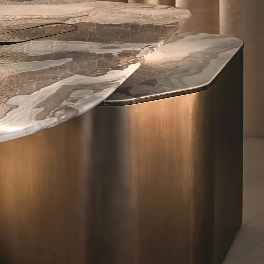 Distinguished Visionnaire Neolito nightstand with asymmetric form and “leather”-finish marble displaying grey and beige veining in metallic bronze lacquer