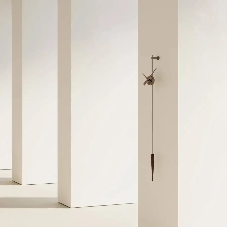 Elegant Nomon Punto y Coma clock crafted in medium-brown wood with dark metal hands and a smooth satin finish