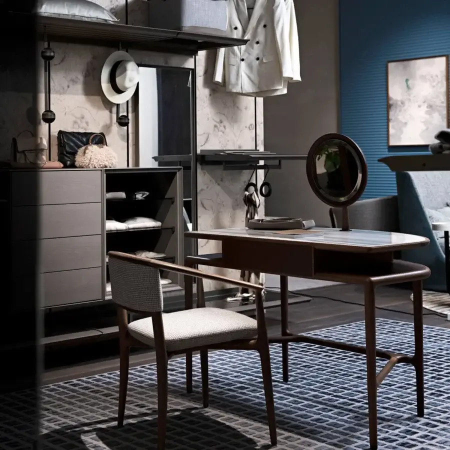 Elegant Giorgetti Sinbad armchair with sculpted Canaletto walnut frame and subtly patterned beige and gray textile upholstery