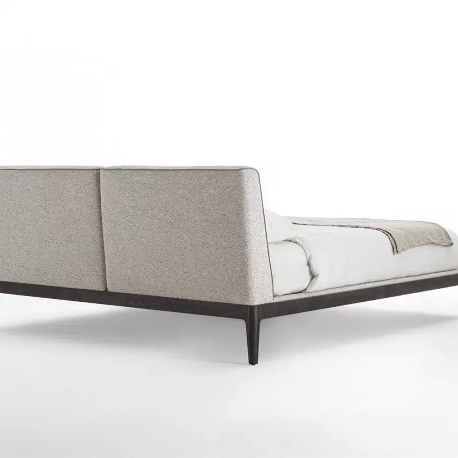 Elegant Porada Ziggy Bed Soft with a solid canaletto walnut frame and fully upholstered neutral beige textile with textured finish