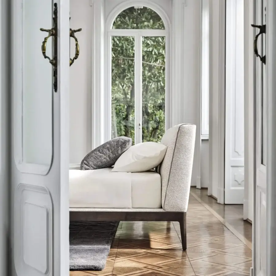 Superior Porada Ziggy Bed Soft with a solid canaletto walnut frame and fully upholstered off-white textile, crafted with elegant piping details