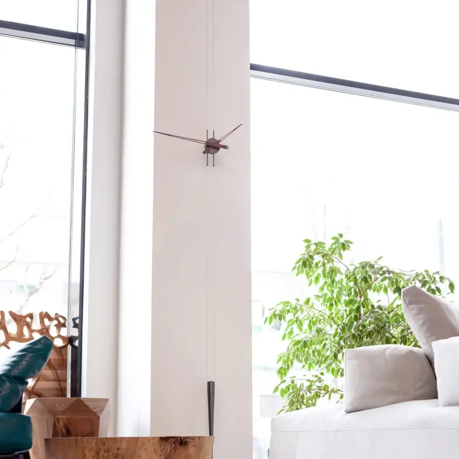 Superior Nomon Péndulo Pendulum Clock wall sculpture crafted in wood with a satin finish and dark toned hands