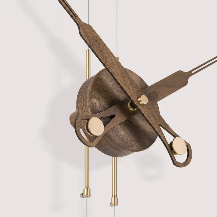 Distinctive Nomon Péndulo Premium pendulum clock crafted in wood with golden metal accents and a satin finish