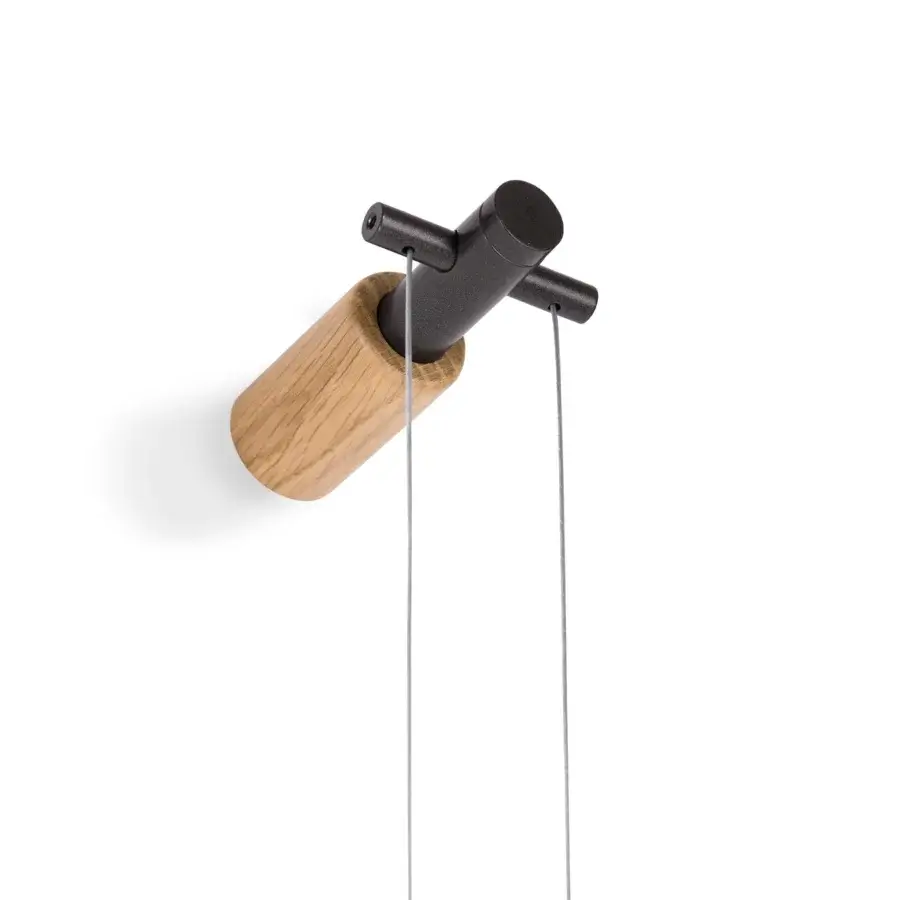 Superior Nomon Péndulo Premium pendulum clock crafted in wood and black metal with a satin finish