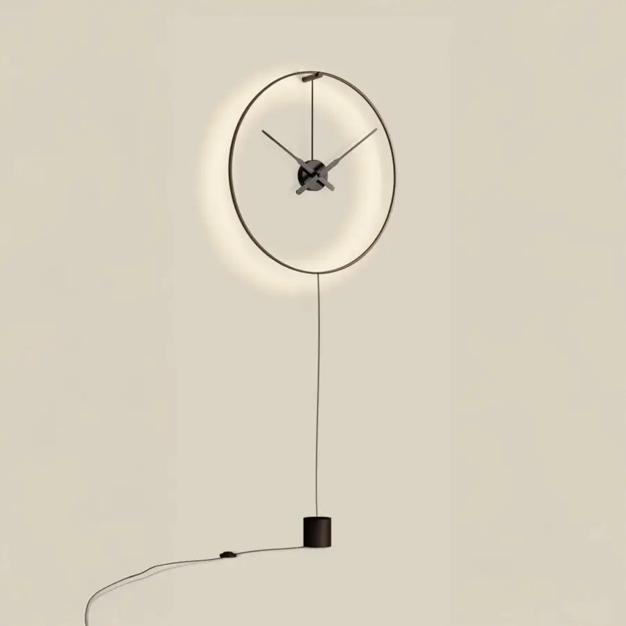 Elegant Nomon Ombra clock lamp with black anodized aluminum and integrated LED system for ambient light