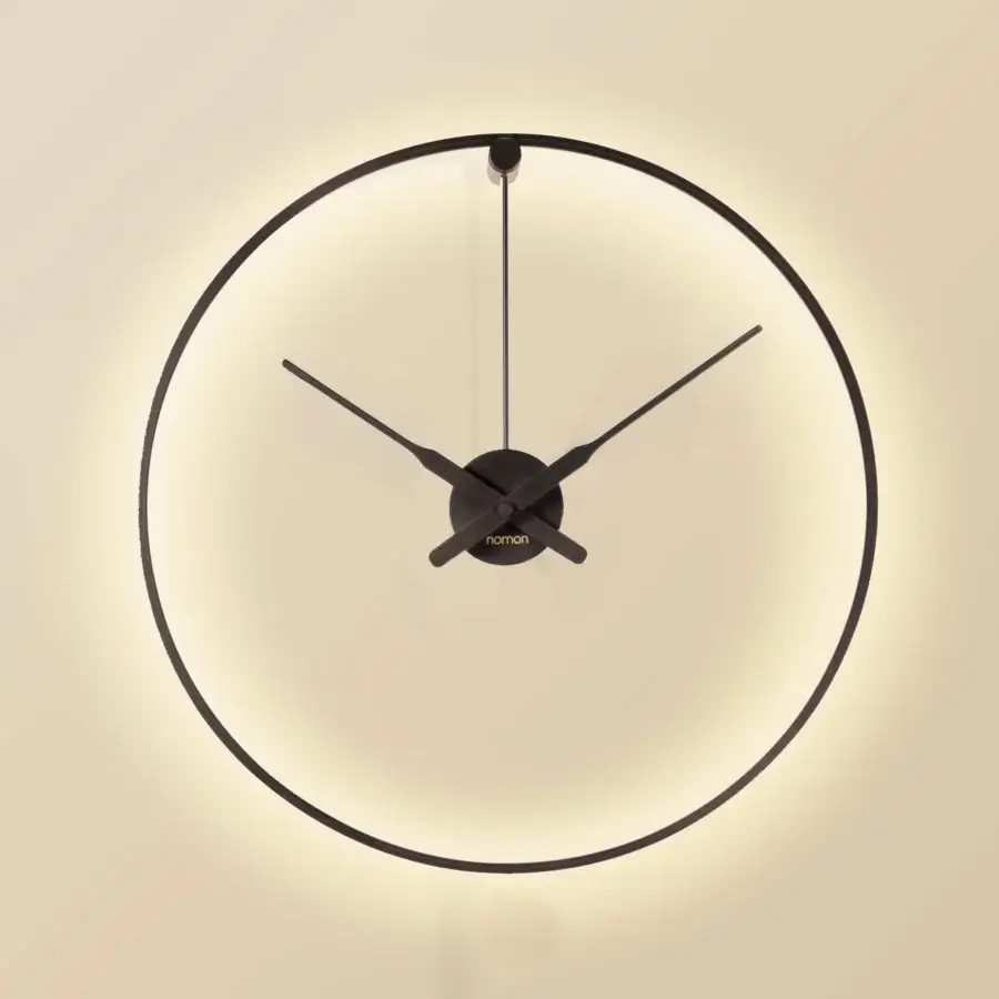 Elegant Nomon Ombra clock lamp in black anodized aluminum with integrated LED system and circular form