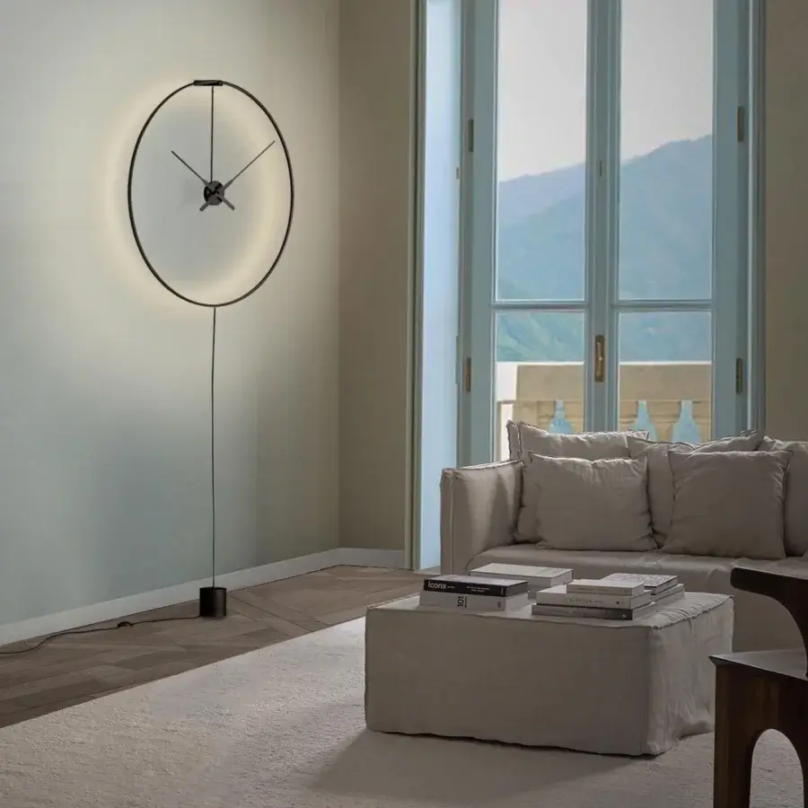 Exceptional Nomon Ombra clock lamp crafted in black anodized aluminum with a pale gold clock face and refined finish