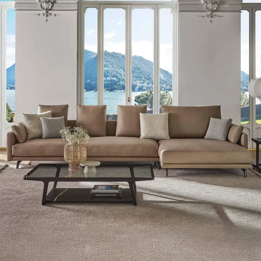 Lavish Porada Étienne sofa with muted brown fabric upholstery and pewter grey metal feet with wooden inserts