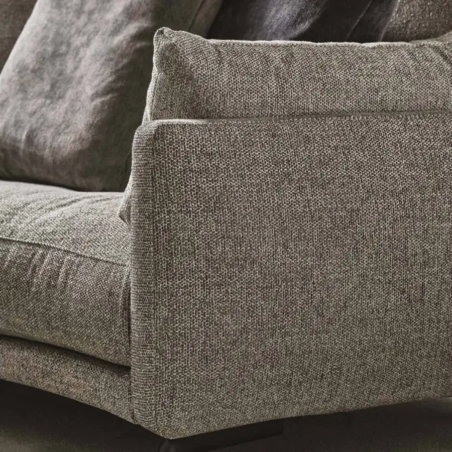 Lavish Porada Étienne sofa with linear design upholstered in muted gray Microflock and pewter grey metal feet crafted with wooden inserts