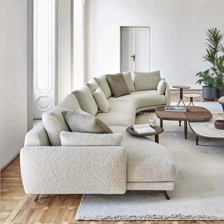 Superior Porada Étienne sofa with linear design upholstered in textured beige Microflock and pewter grey metal feet