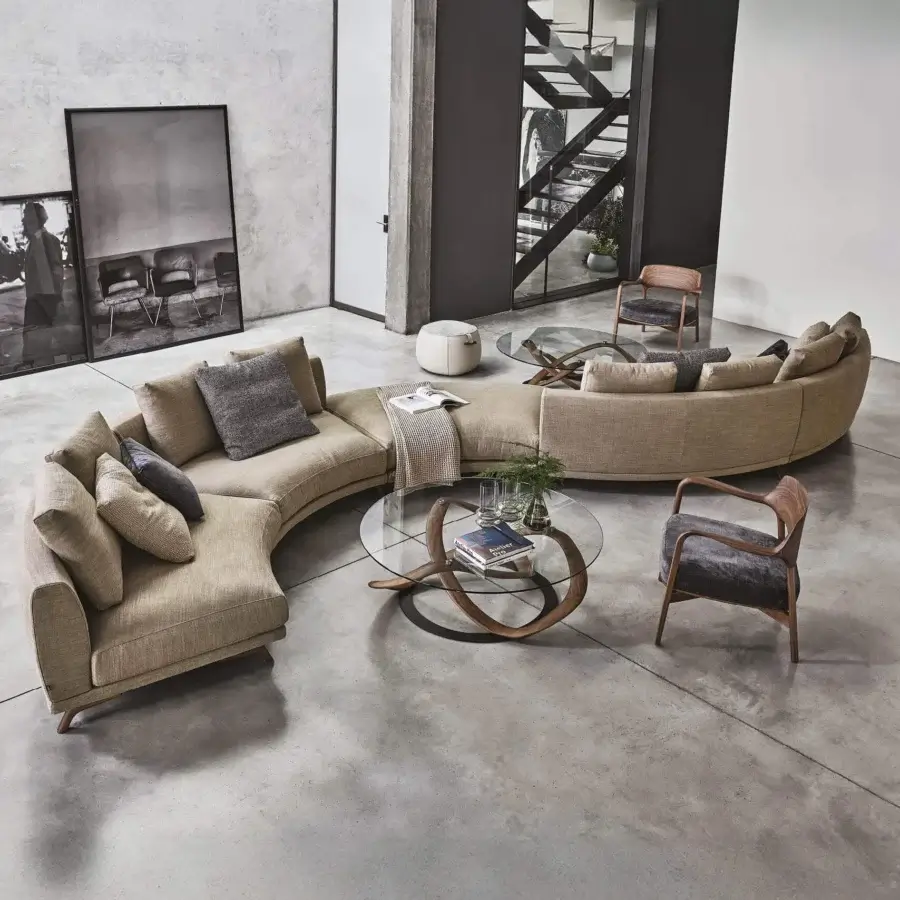 Lavish Porada Étienne sofa with pewter grey metal base and neutral beige Microflock upholstery exhibiting a subtly textured finish