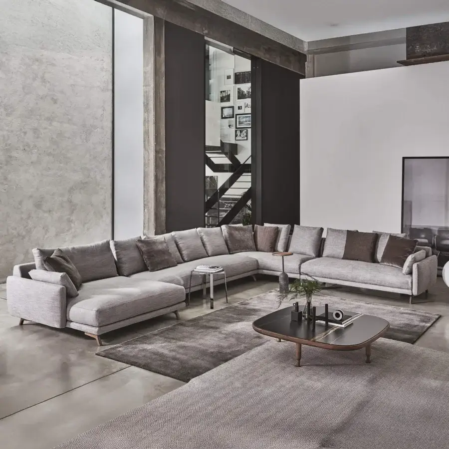 Superior Porada Étienne sofa with pewter grey metal feet, wooden inserts and light grey matte fabric upholstery